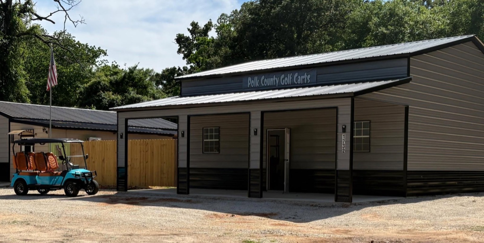 The Polk County Golf Carts shop building with a teal cart parked out front